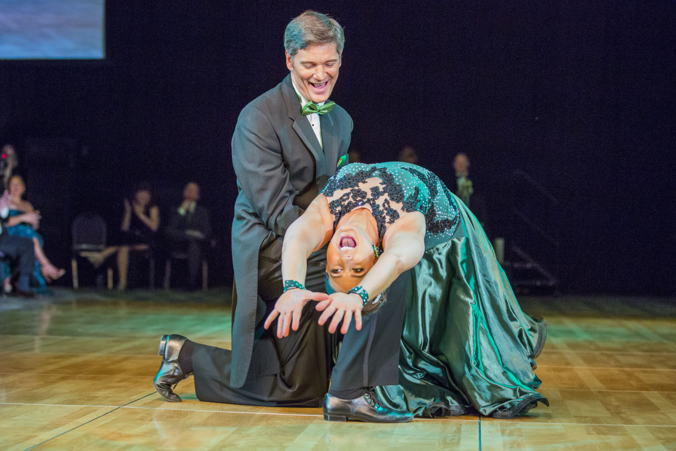 Elegant black drape event setup with ambient lighting