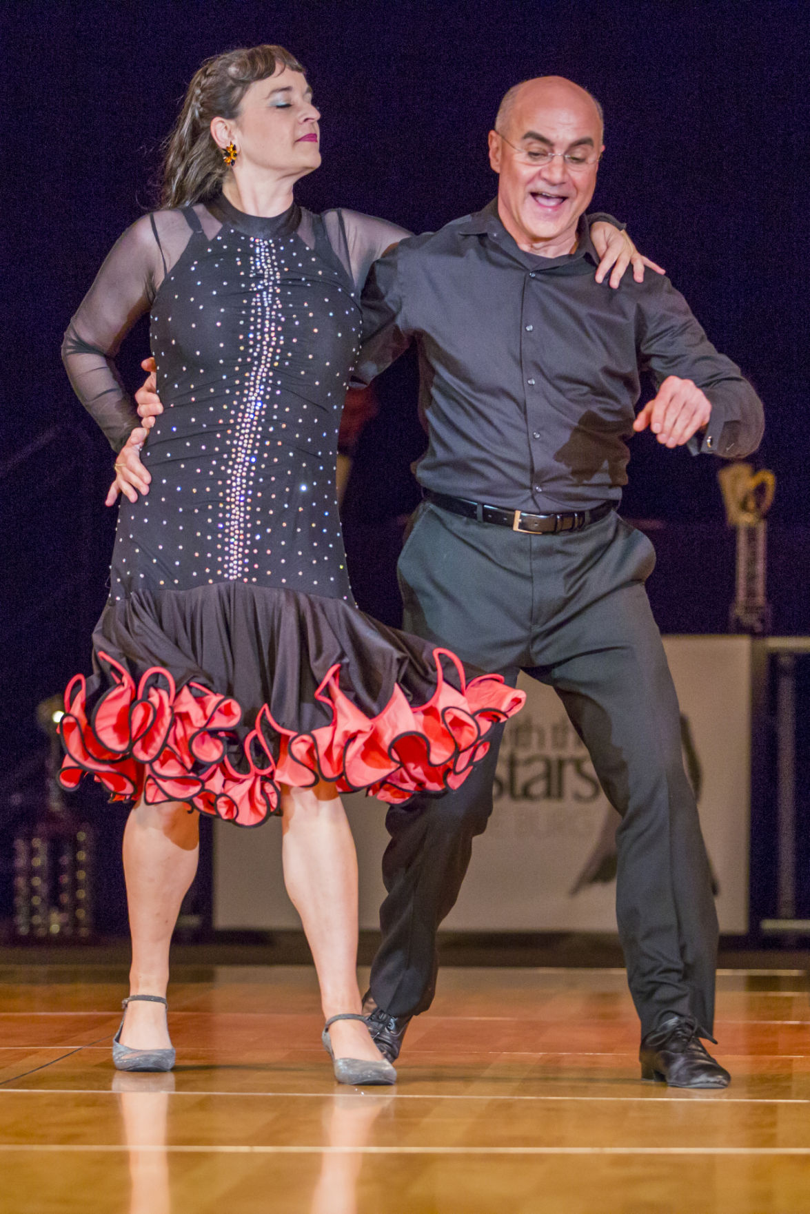 Black drape stage backdrop with colored uplighting