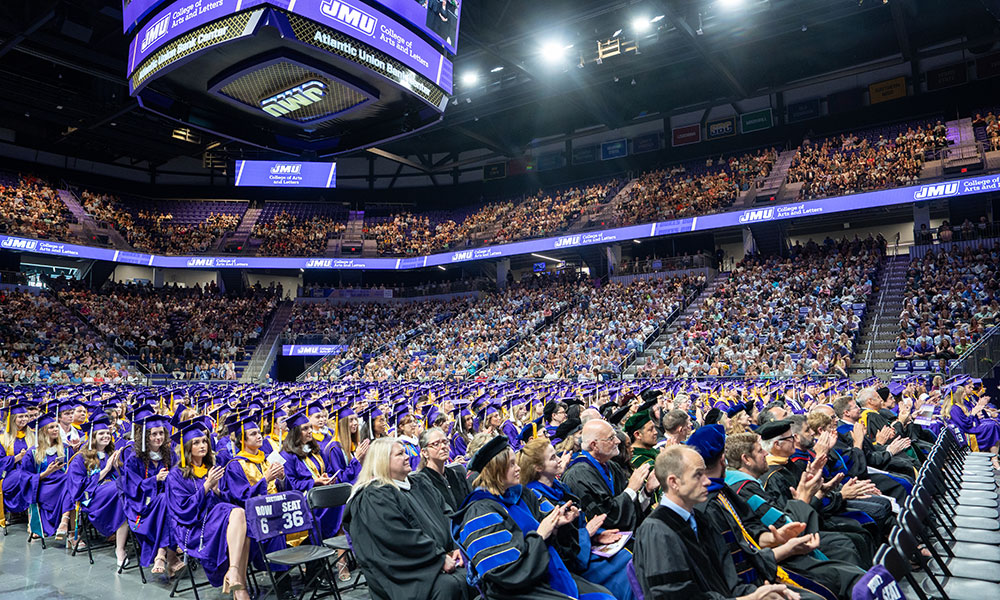 JMU event with official purple drape backdrop
